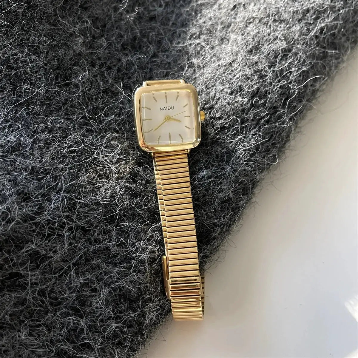 Gold-tone square NAIDU women's quartz wristwatch with adjustable stainless steel bracelet