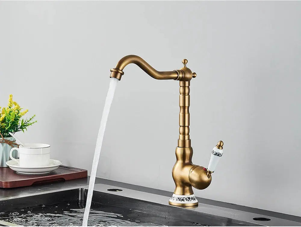 Antique brass bathroom faucet with rotating spout and ornate base, basin sink mixer, Simples Market