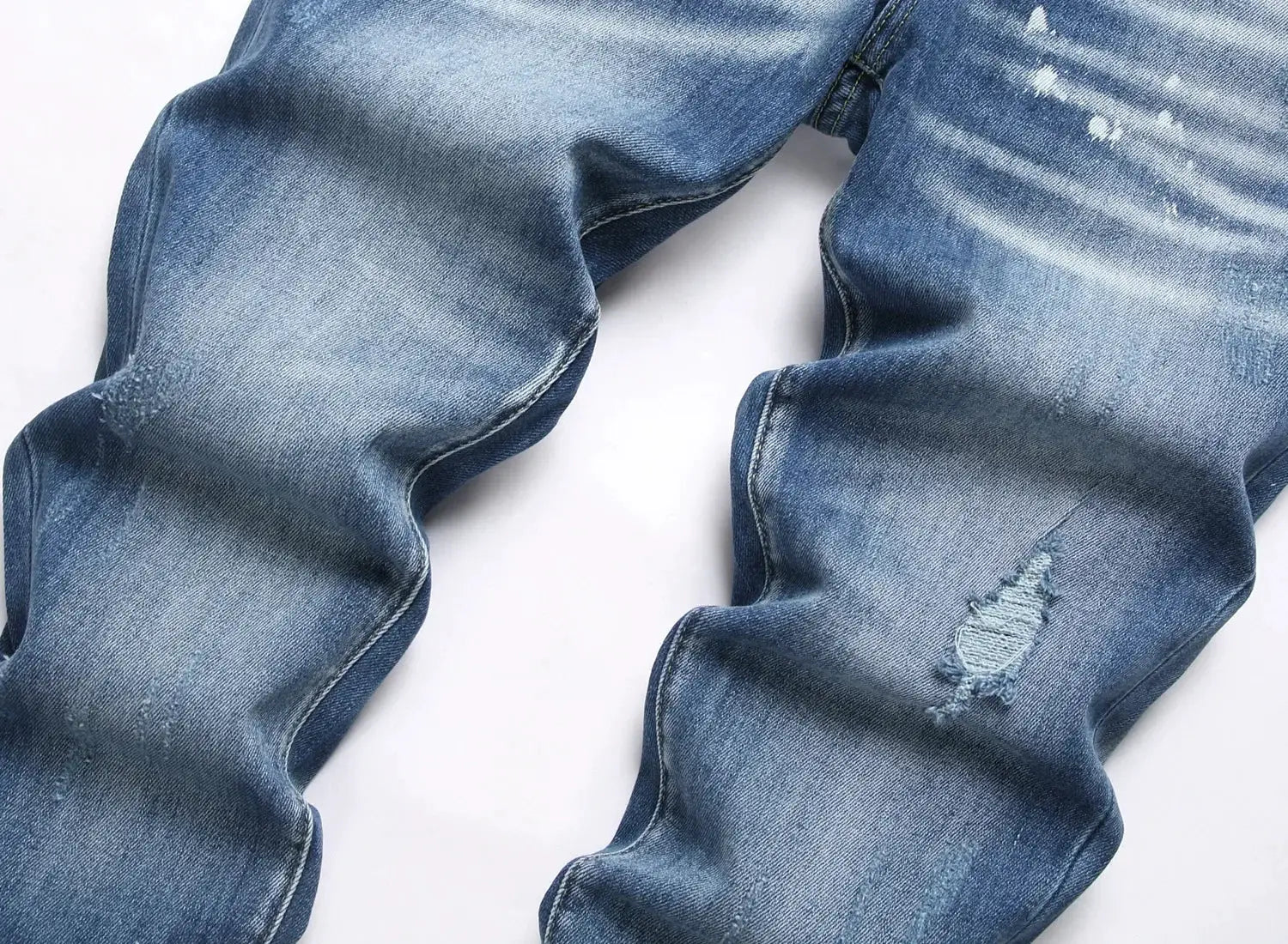 Men's ripped jeans by Simples Market in light blue denim with distressed holes, slim stretch fit