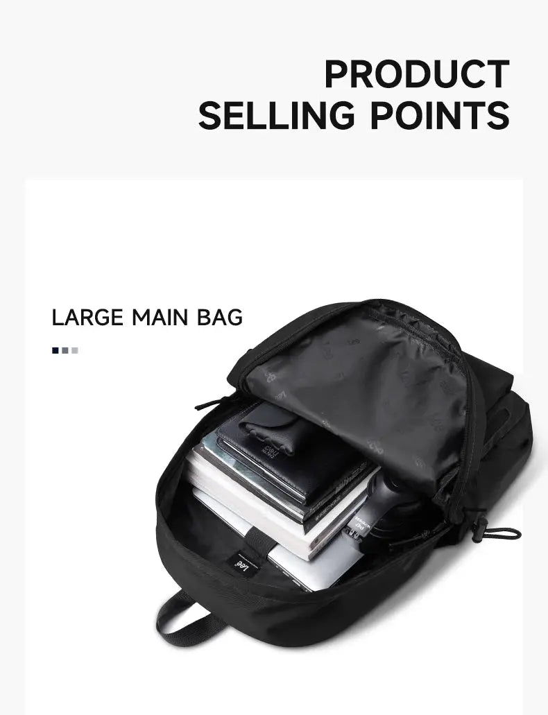 Black Oxford 16-inch laptop backpack with a large main compartment open to reveal books and notebooks