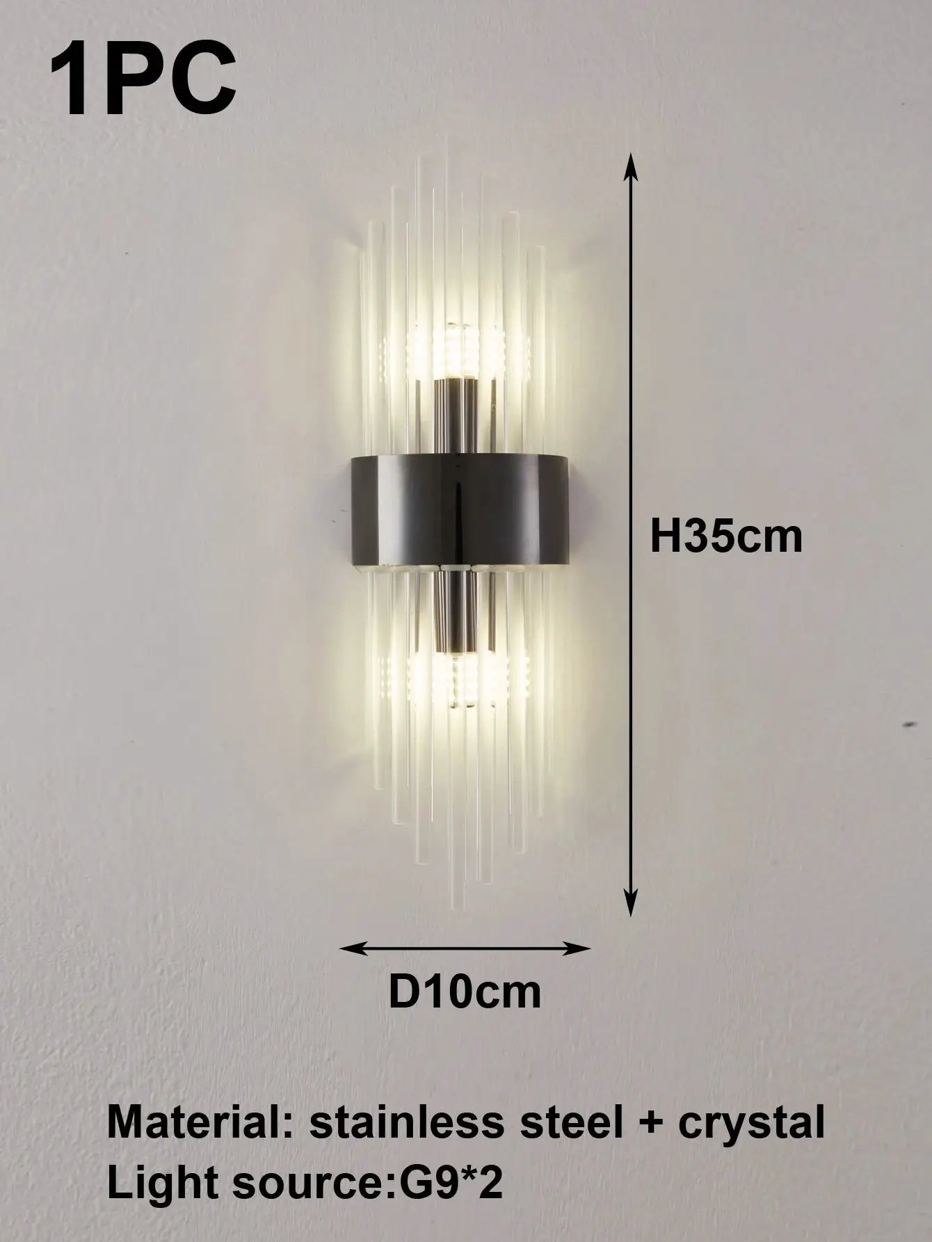 Wall sconce lamp in gold and black stainless steel with crystal accents, G9 light source, Simples Market.