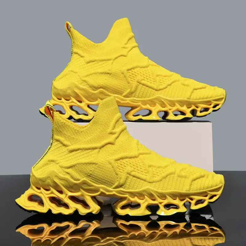Pair of bright yellow knit sneakers with a sculpted honeycomb outsole