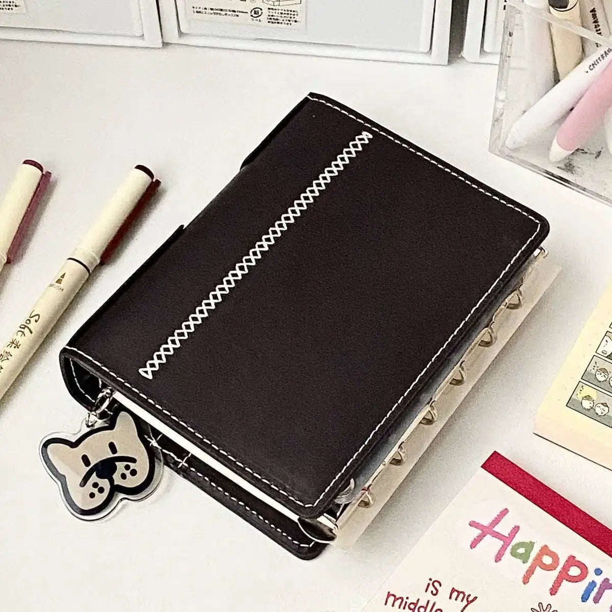 A7 dark brown faux leather planner with white contrast stitching and detachable loose-leaf pages, 80 pages