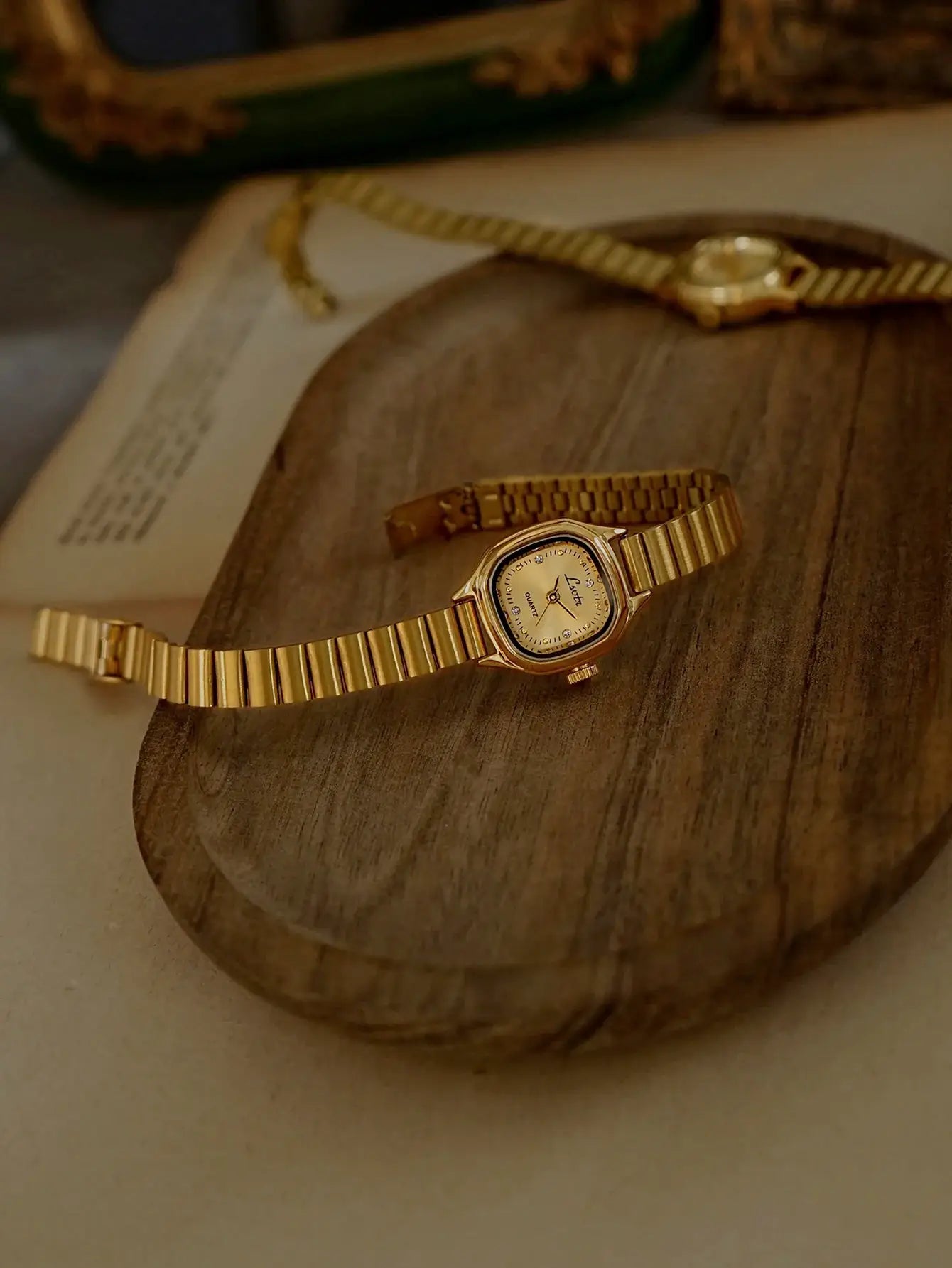 Simples Market two gold-tone women's square-dial watches on stainless steel bands