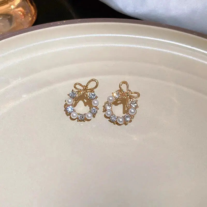 Hollow-out round rhinestone bow stud earrings, gold-tone with imitation pearls (pair)