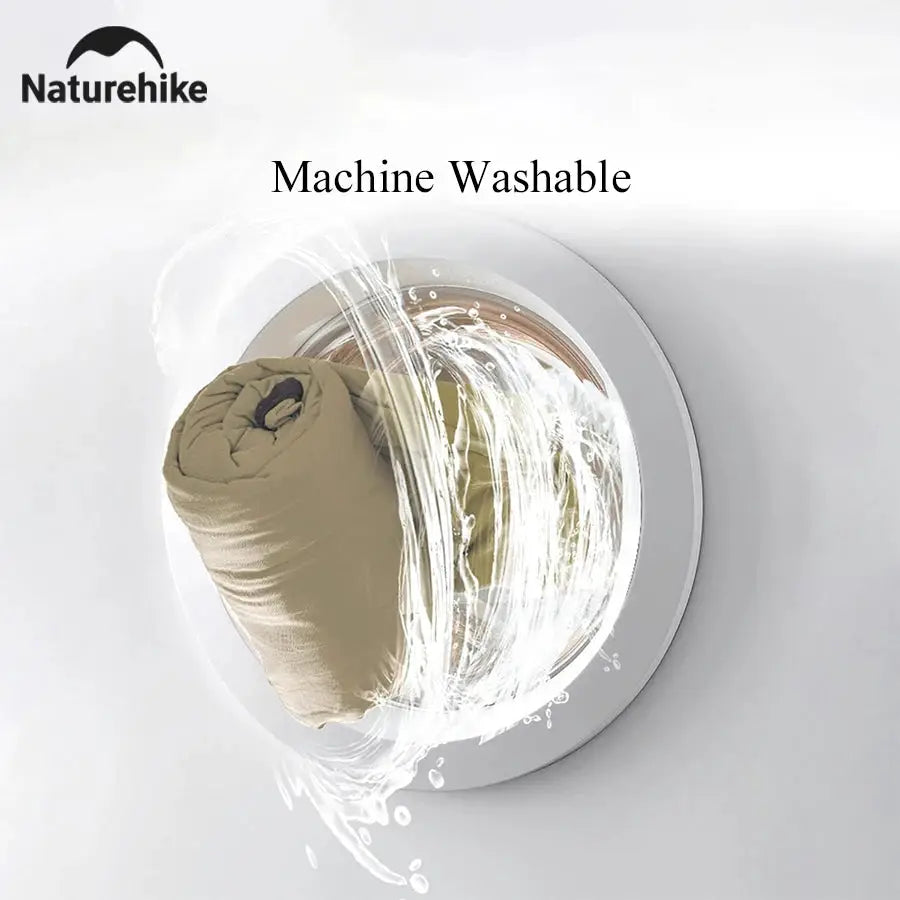 Naturehike sleeping bag liner, beige, machine washable, in a front-loading washing machine.