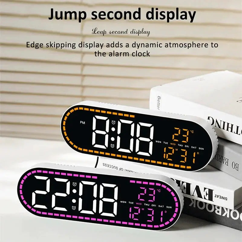Digital LED wall clocks; two oval units with orange and purple edge, displaying time, date and temperature.