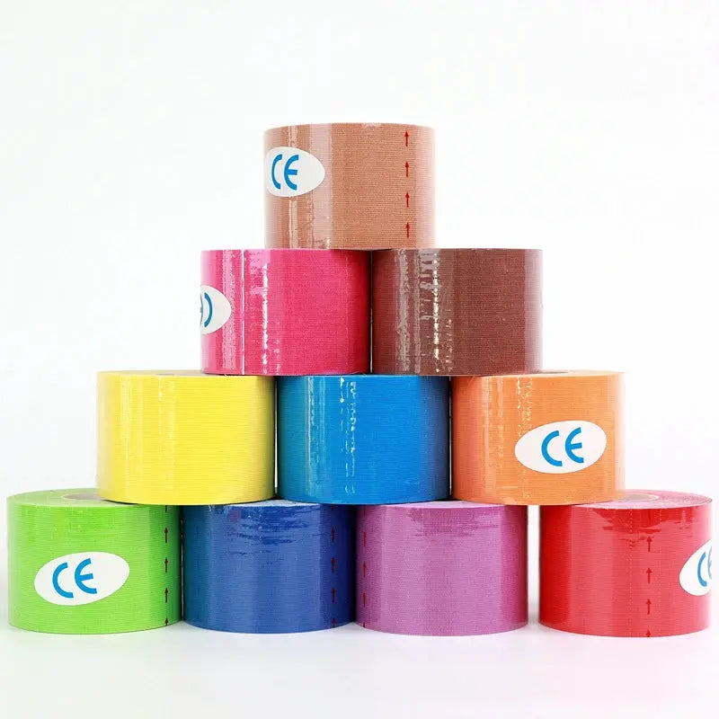 Simples Market kinesio tape rolls in assorted colors with CE labels, stacked in a pyramid.