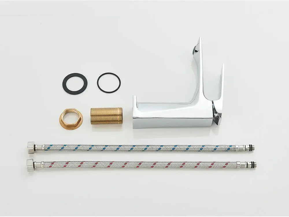 Chrome deck-mounted bathroom faucet with single lever and braided hot/cold supply hoses and fittings.