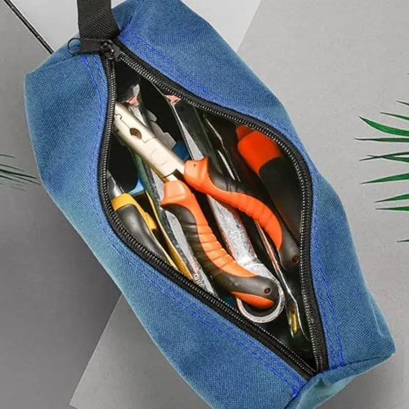 Small blue Oxford cloth hand-held tool bag by Simples Market, opened to show pliers and screwdrivers inside