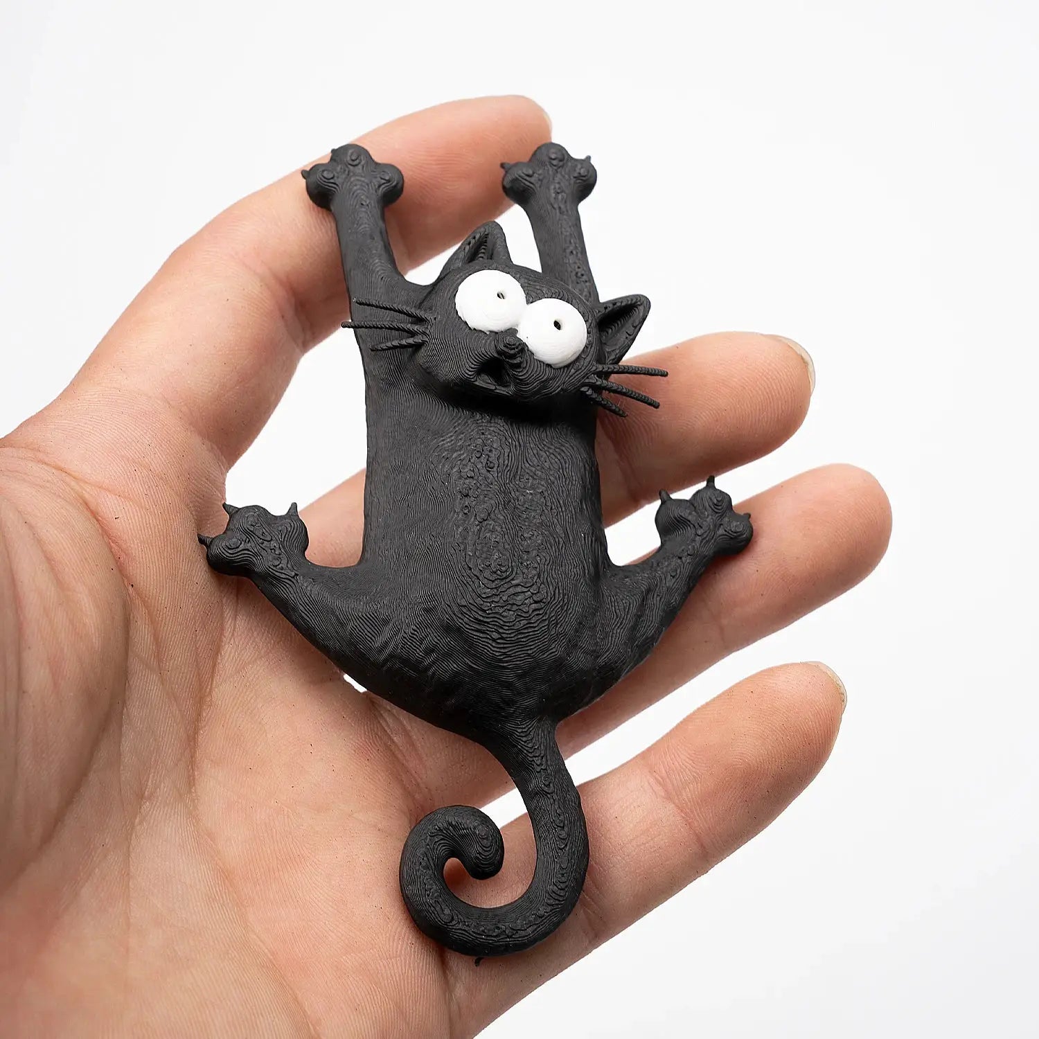 Magnetic fridge magnet by Simples Market; black cartoon cat with large white eyes