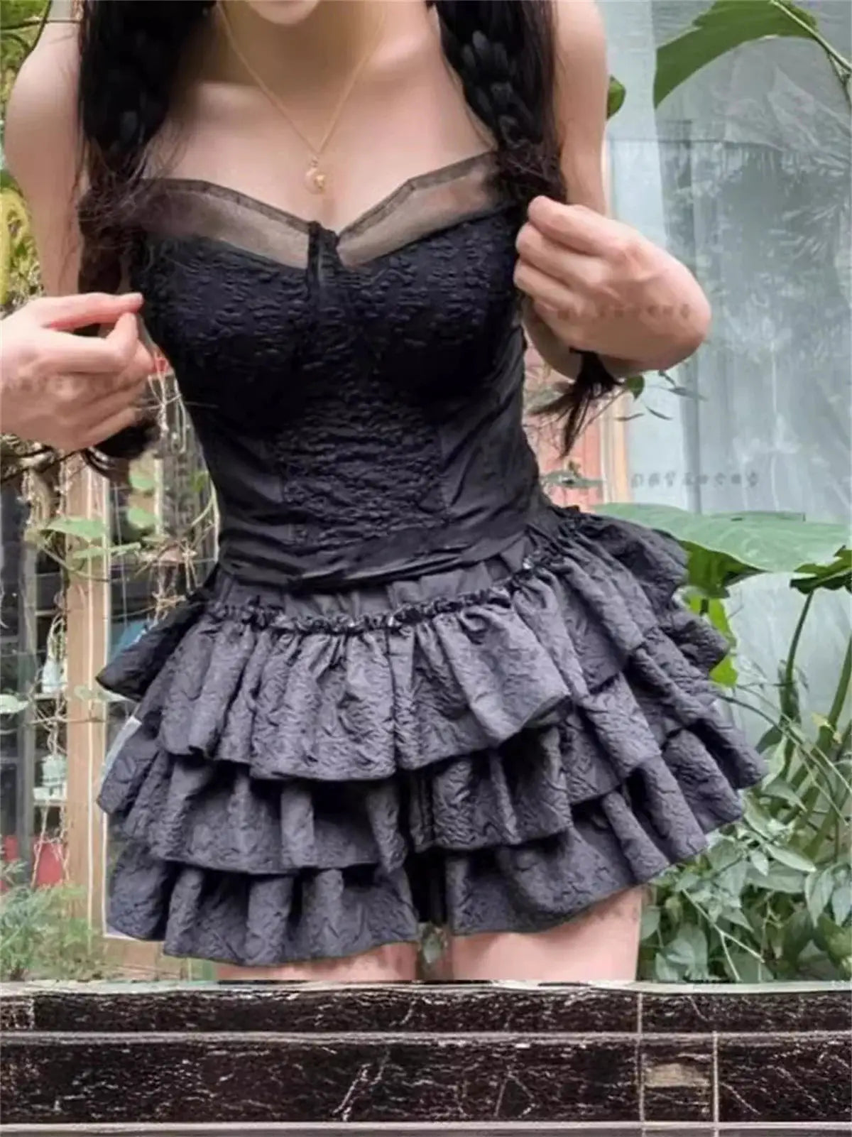 Black Lolita-style dress with lace bodice and layered short ruffle skirt