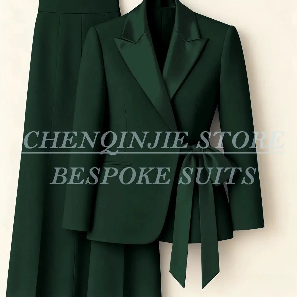 Green women's blazer suit set with peak lapels and waist belt, two-piece jacket and pants