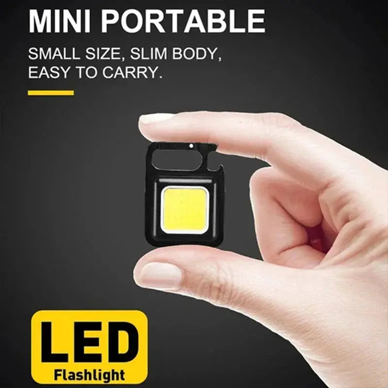 Mini black keychain LED flashlight with COB LED, compact and portable