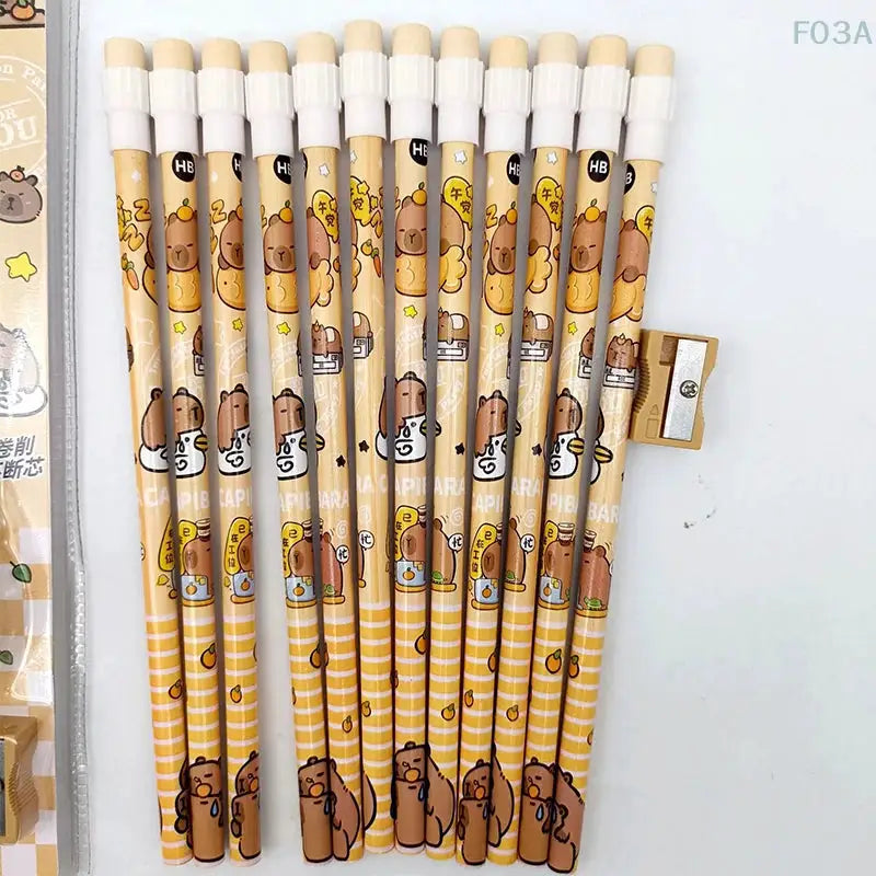 12pc Simples Market capybara HB pencils set with sharpener; yellow striped wooden pencils with cute capybara designs.