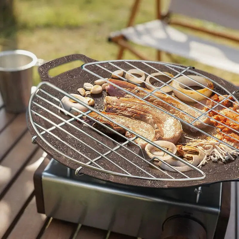 Barbecue net steam rack stainless steel for camping over a portable stove with meat and vegetables