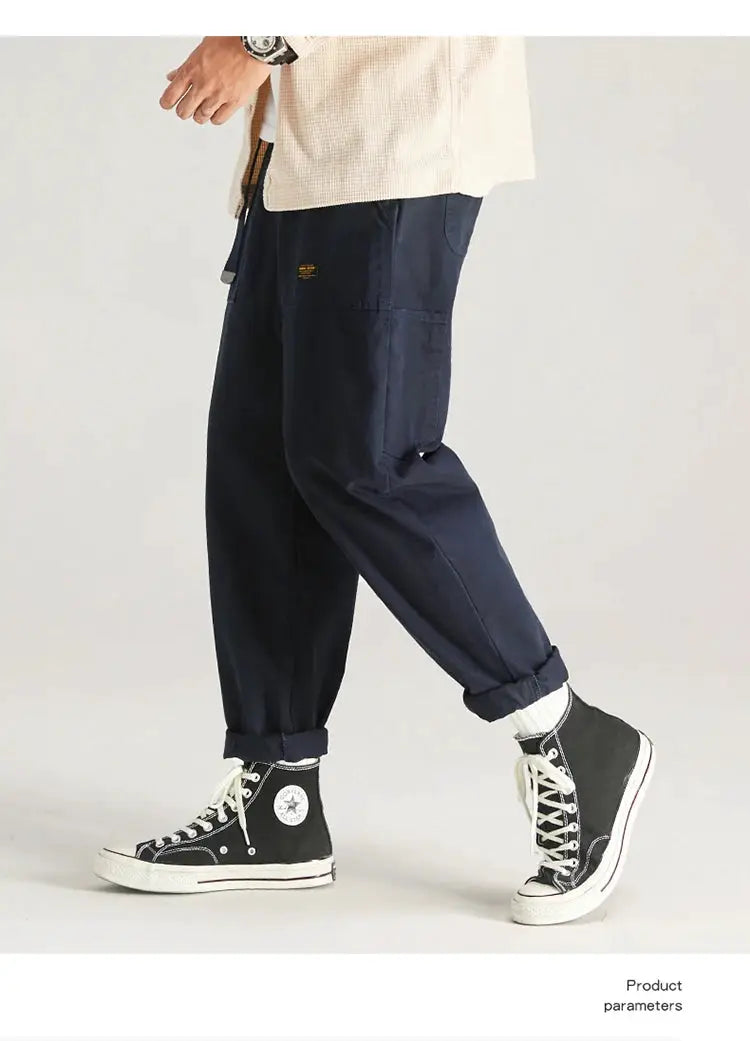 HIQOR men's navy cargo pants with multiple pockets, baggy fit and rolled cuffs.