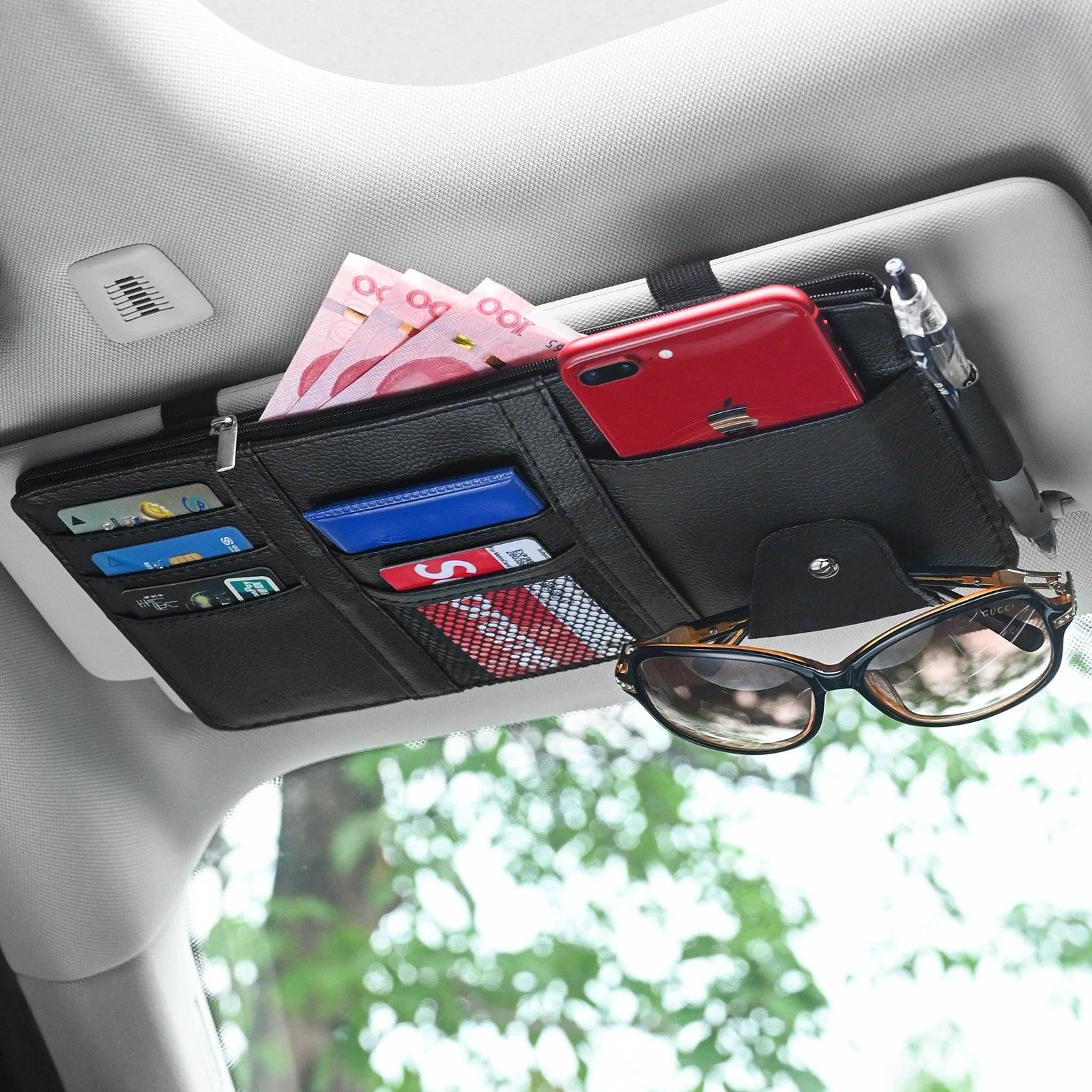 Car sun visor organizer in black leather with card slots, sunglasses clip and pen holder