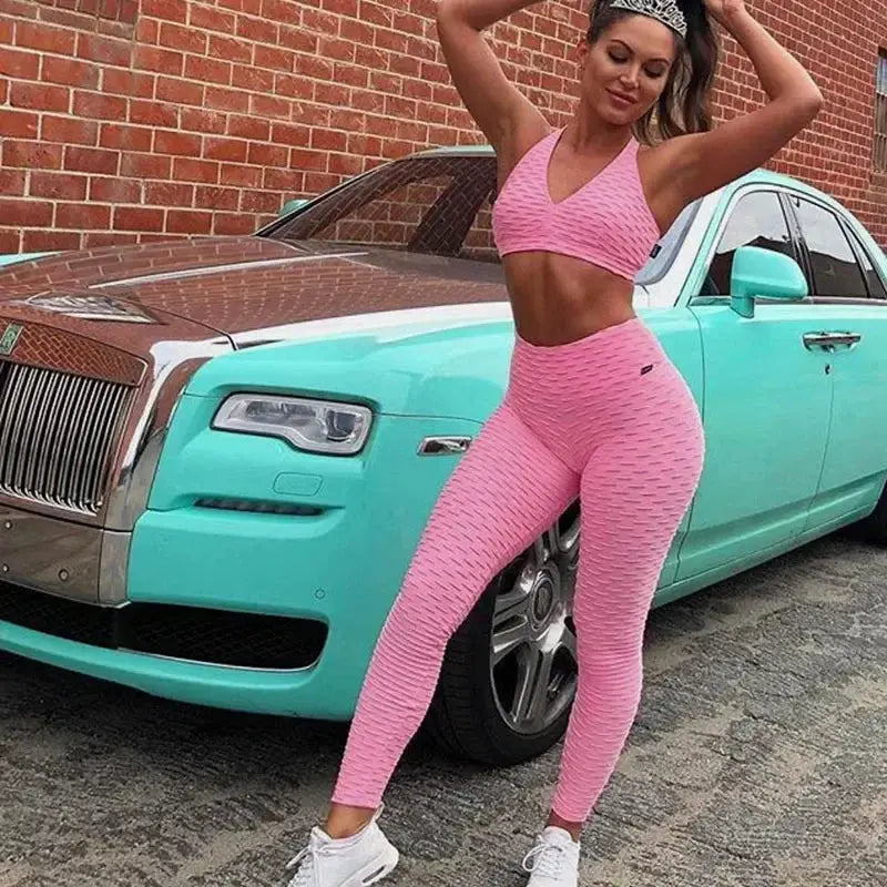 Pink women's high-waist bubble leggings and sports bra set, seamless yoga pants with hip-lifting fit
