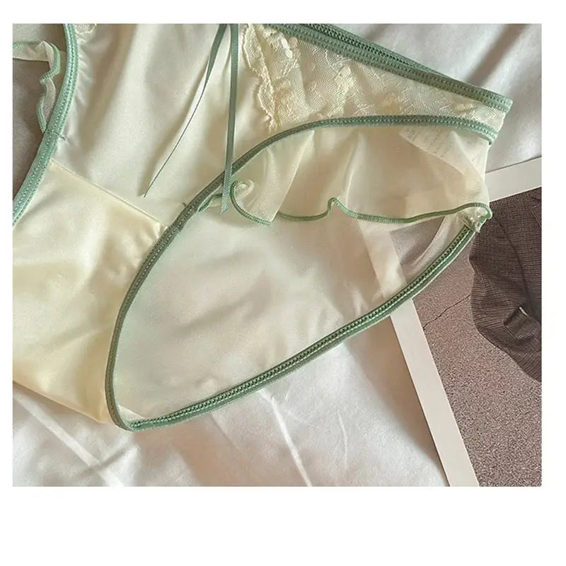 Women’s low-waist lace mesh satin panties with mint green ruffle edge and sheer fabric