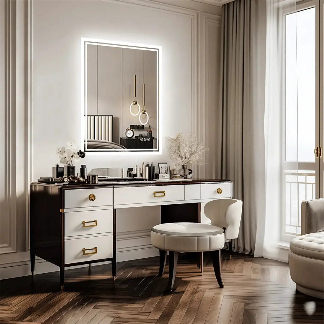 LUVODI Illuminate LED backlit bathroom mirror, frameless with edge glow, mounted above a white-black vanity.