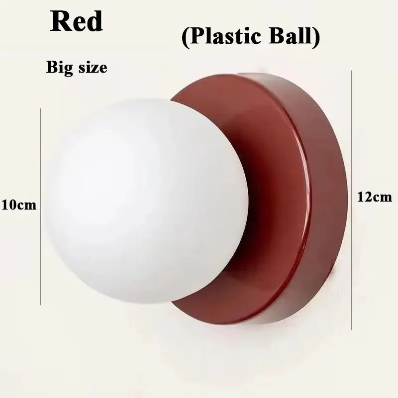 Macaron-style wall lamp with iron base and plastic ball shade; red back plate, modern E27 sconce
