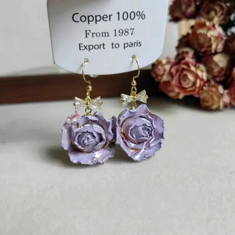 Elegant Immortal Rose Long Earrings pair, purple epoxy resin rose pendants on gold hooks