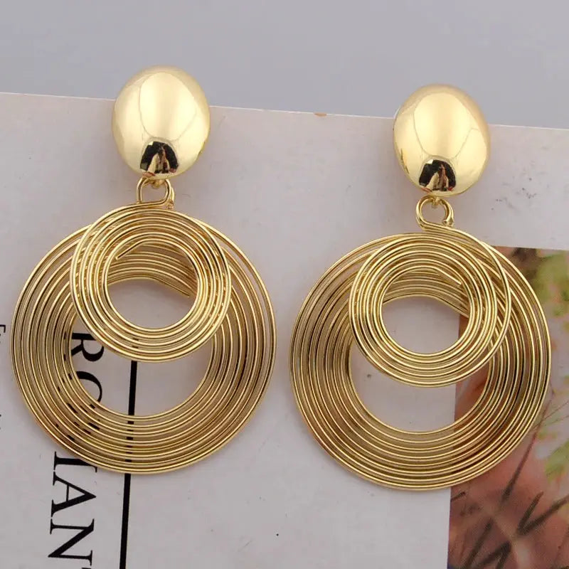 Gold-tone big round statement earrings for women, pair with concentric ring hoops, dangle drop style