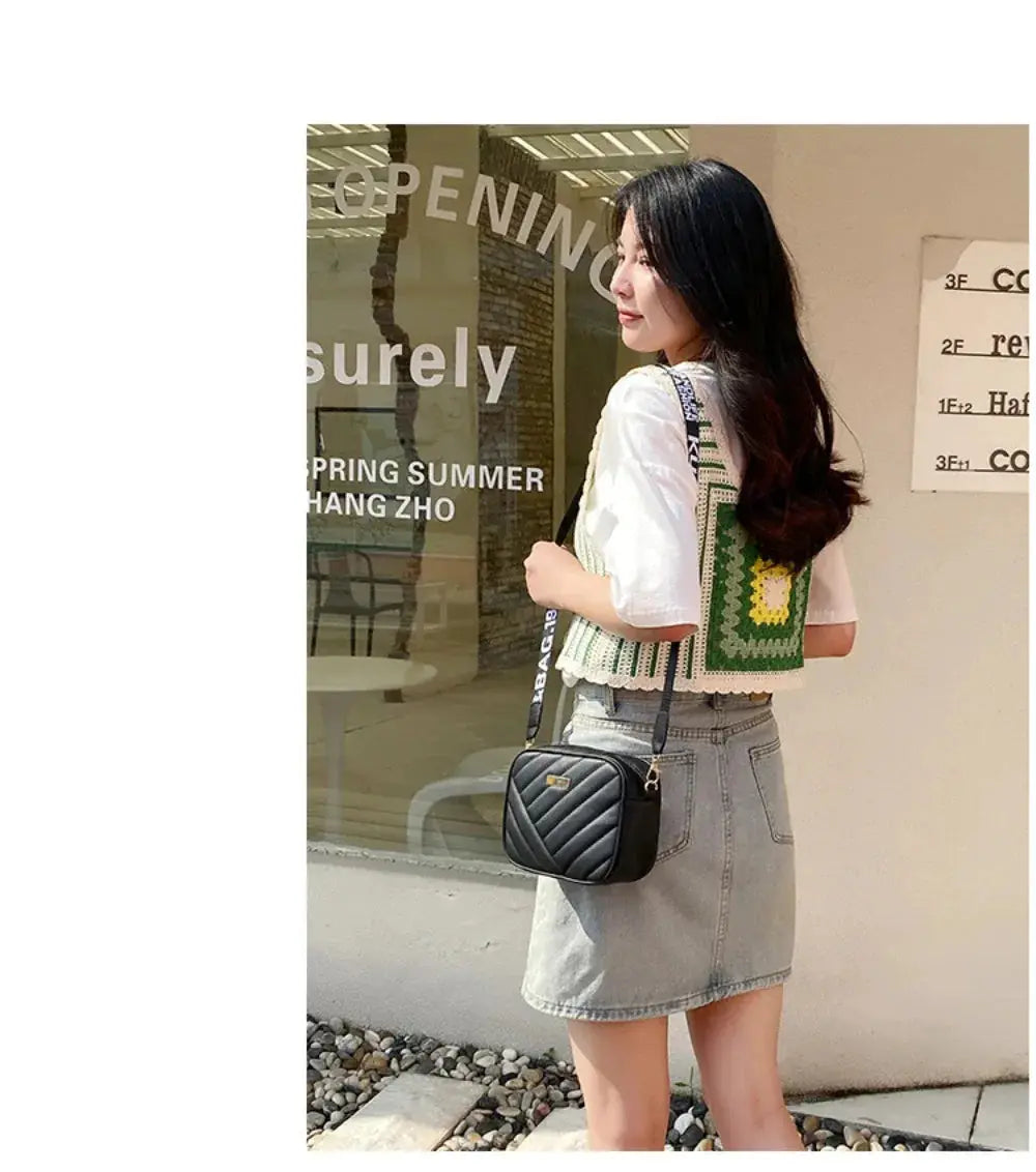 Shoulder bag, black PU leather with quilted chevron pattern, crossbody style.