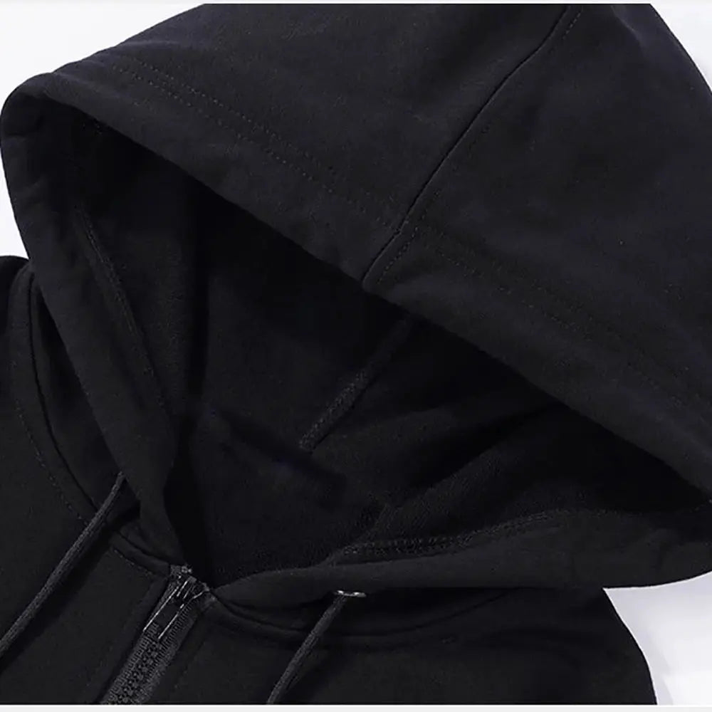 Zip hoodie in black with hood and drawstrings; unisex long-sleeve casual sweatshirt.