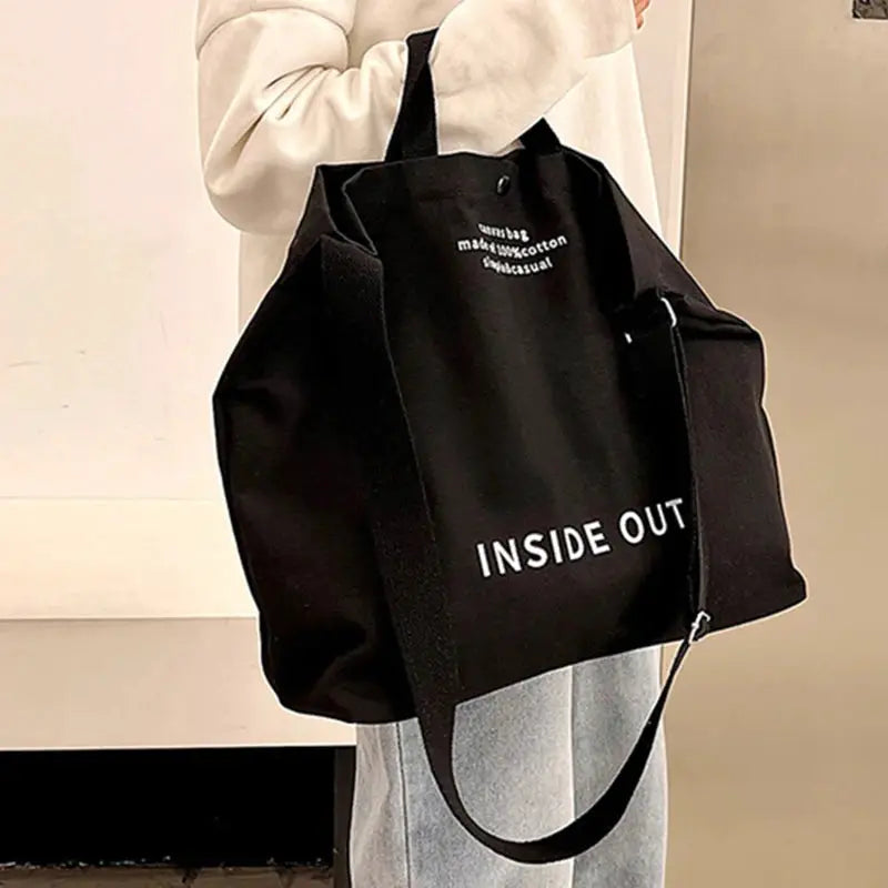 Canvas cross-body bag by Simples Market, black canvas with large capacity and INSIDE OUT text