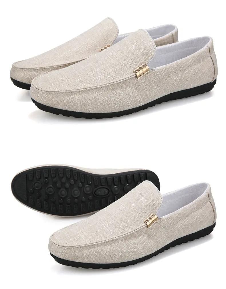 Men's beige canvas slip-on loafers with gold hardware and black sole; set of 2
