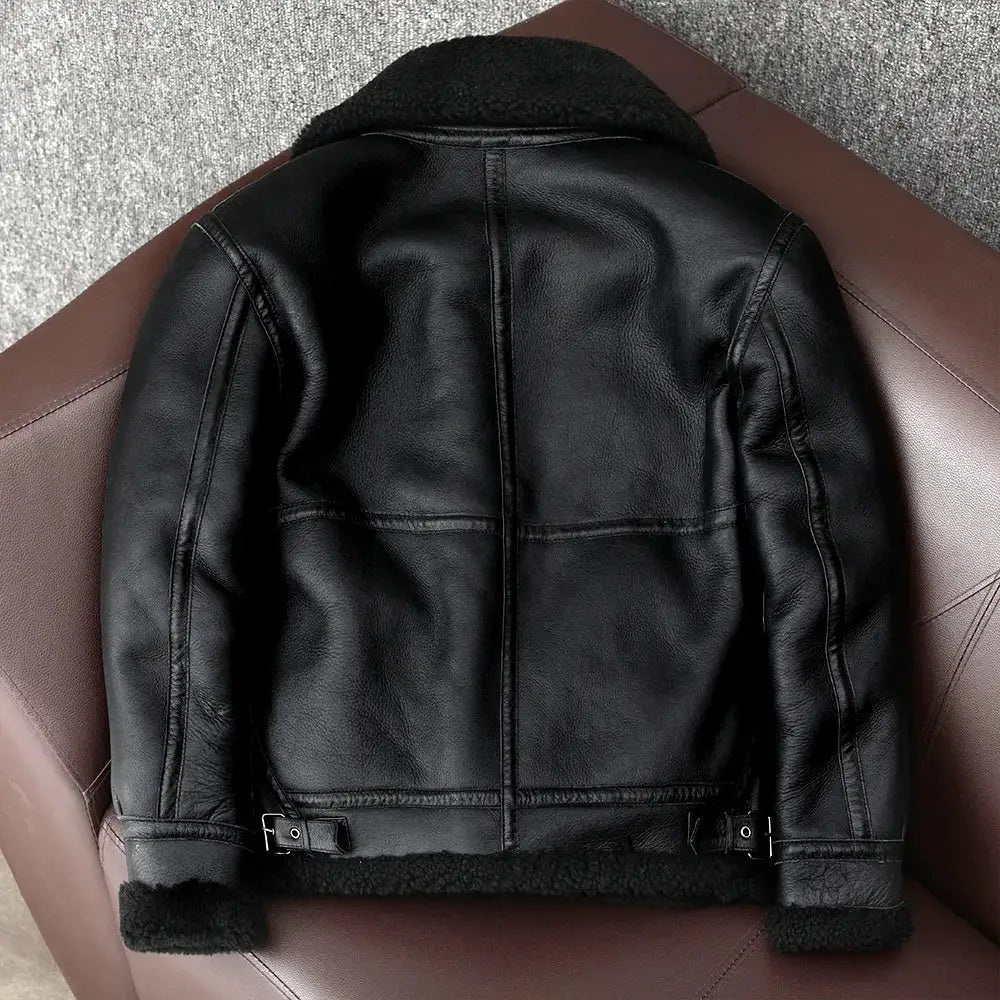 Black leather shearling flight jacket with fur trim and waist buckles
