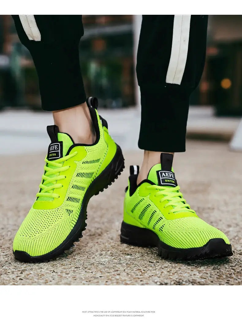 New Men Running Shoes with breathable lime-green knit upper and black rugged sole.