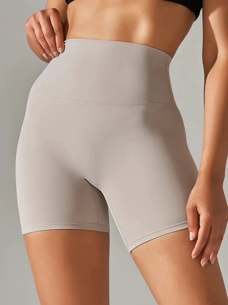 Women's high-waist yoga shorts by Simples Market in beige, squat-proof quick-dry fabric.