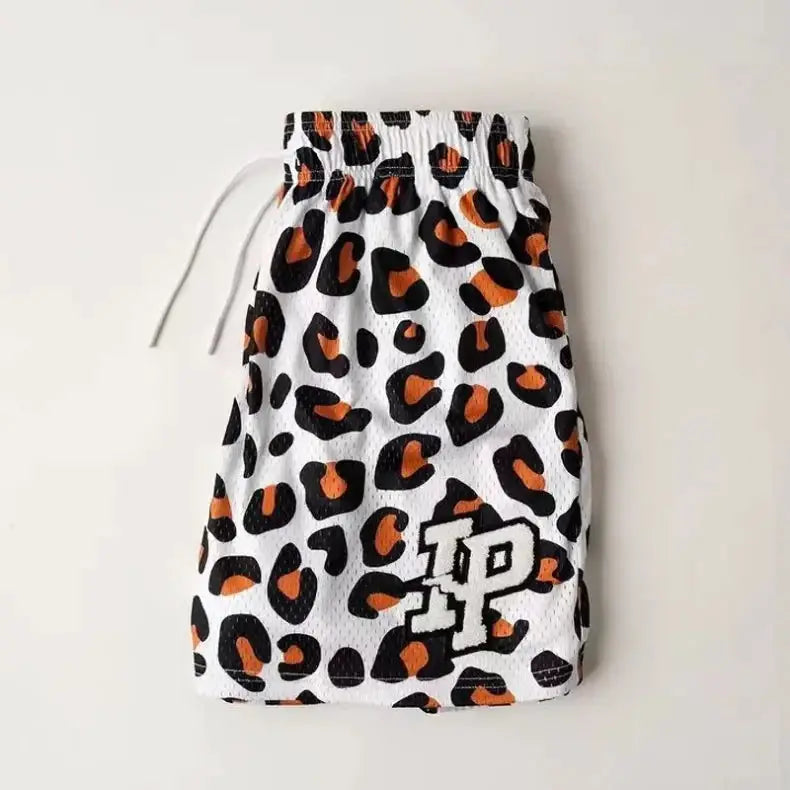 Men's IP leopard-print shorts, white with black and orange spots, drawstring waist
