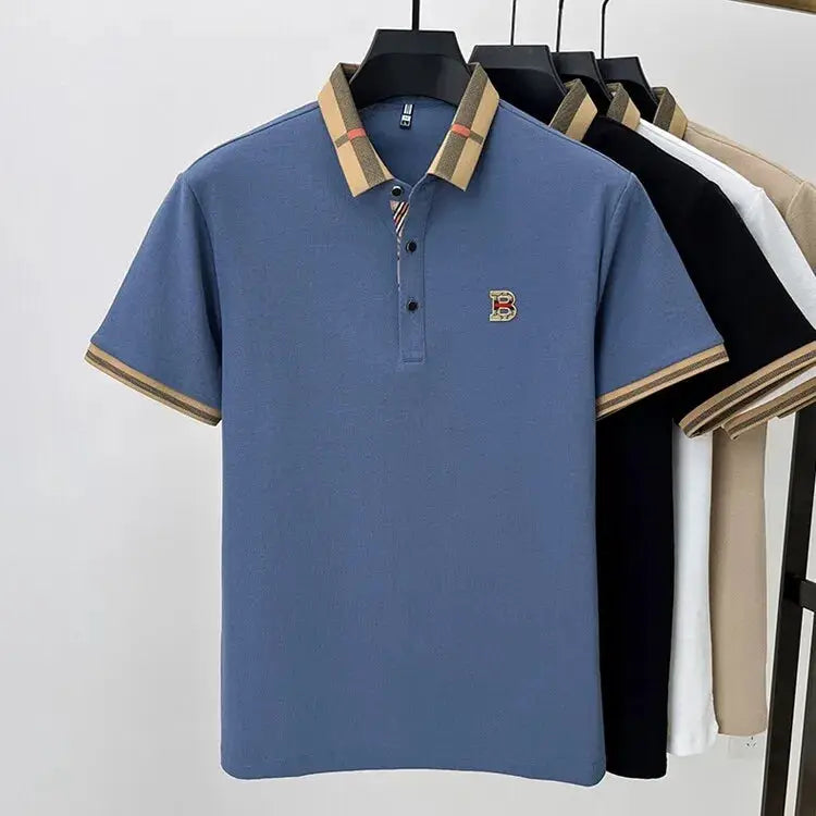 Simples Market blue polo shirt with beige striped collar and B logo; five polo shirts on hangers