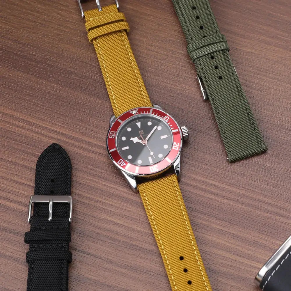 Simples Market watch strap set; waterproof sailcloth nylon two-sided quick-release bands in yellow, black, olive green.