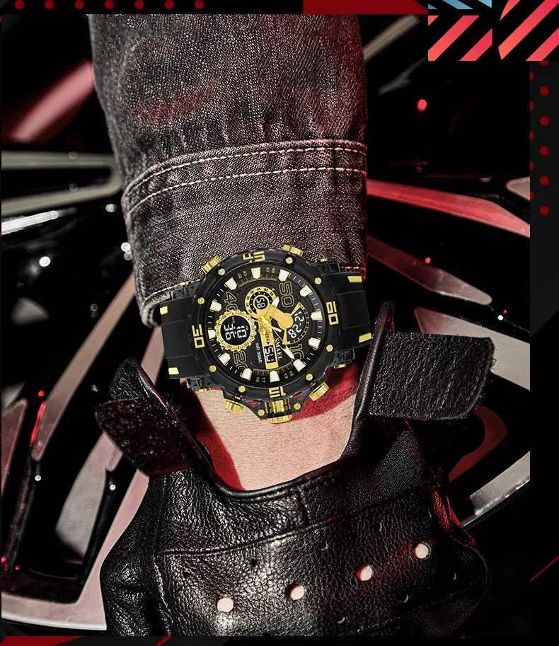 Military-style men's watch with black case and gold accents on a rugged strap worn on a denim sleeve