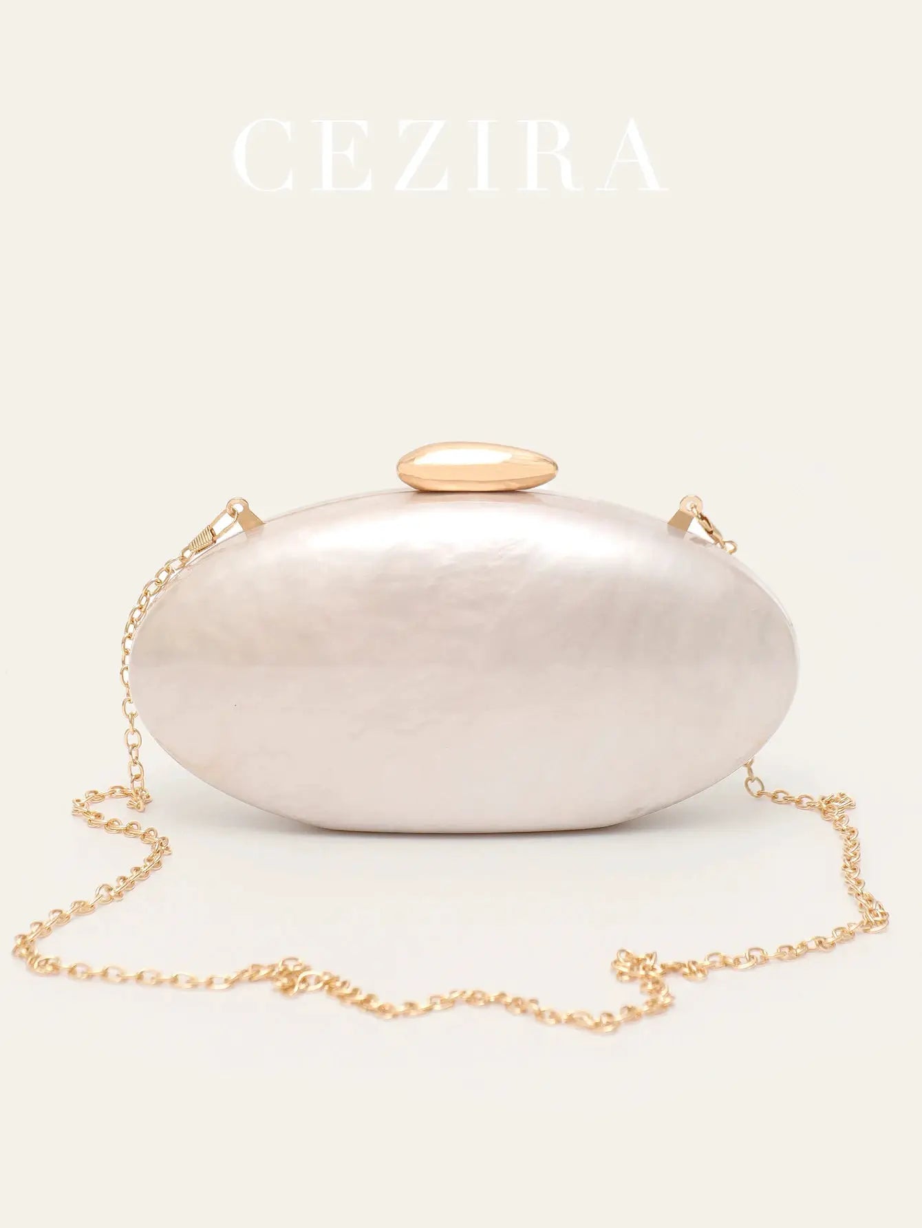 Women's oval pearl pink evening clutch with gold-tone clasp and chain strap by Simples Market