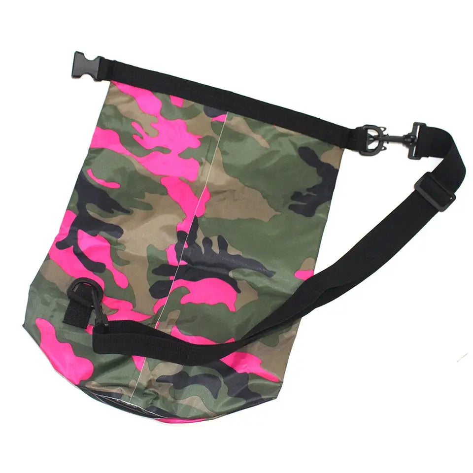 Waterproof dry bag in pink camouflage with black adjustable strap and clip closures