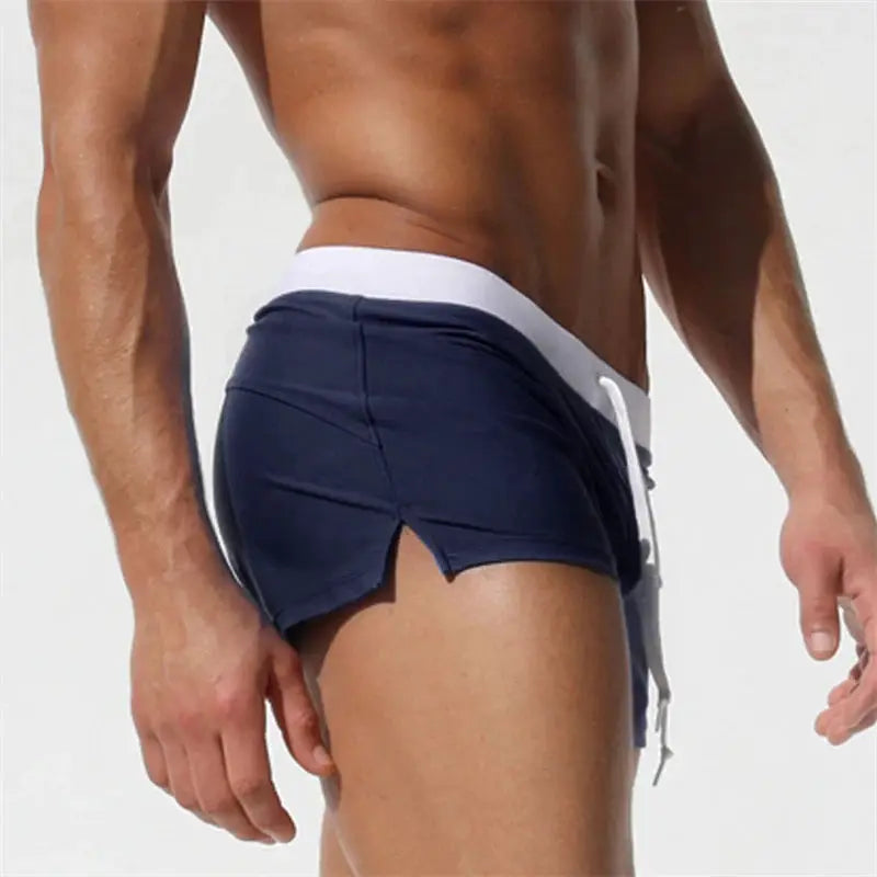 Men's navy blue quick-drying swim trunks with white waistband drawstring