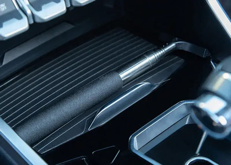 Telescopic car window cleaning tool with black foam grip and metal shaft