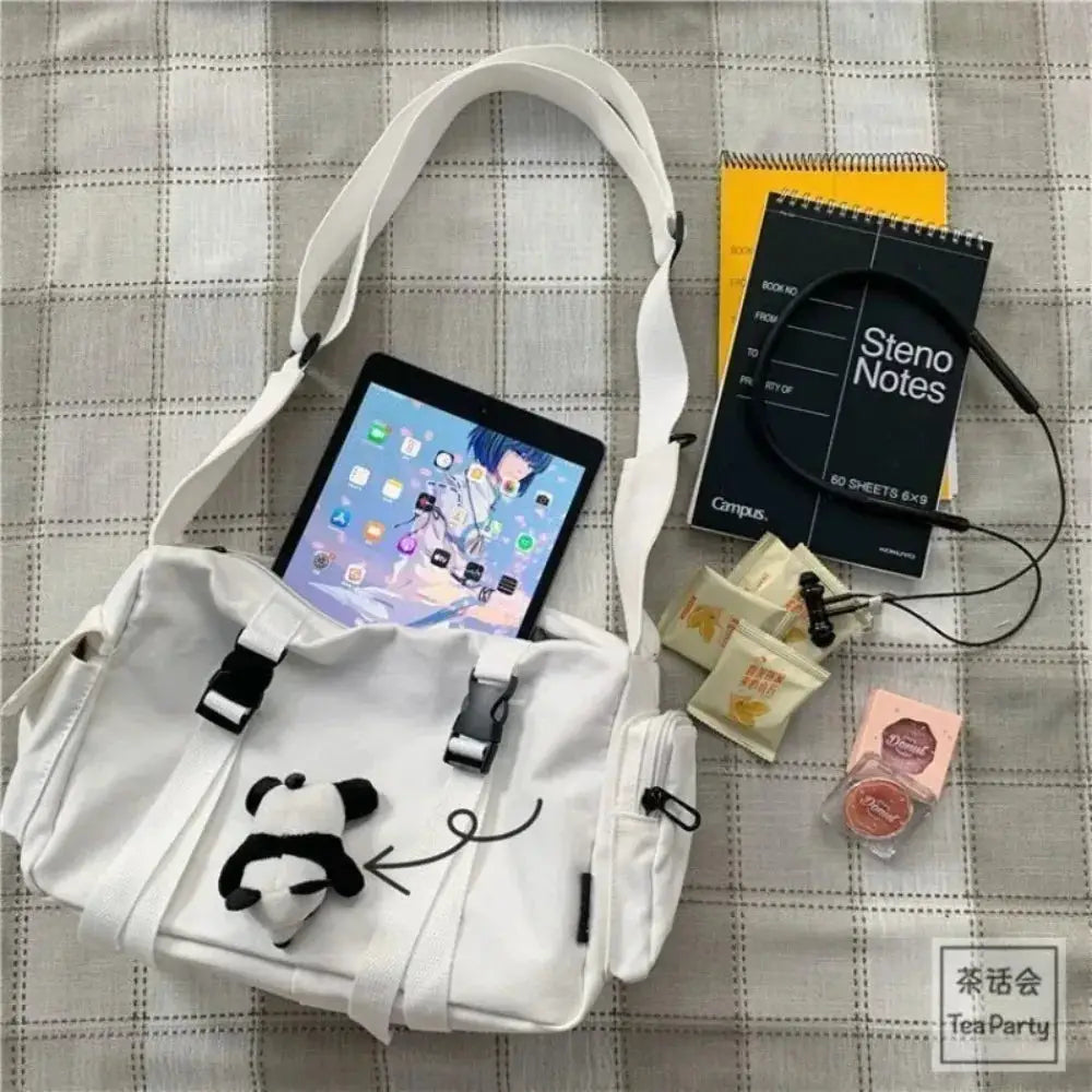 Simples Market white canvas crossbody bag with panda charm, large capacity, adjustable strap.