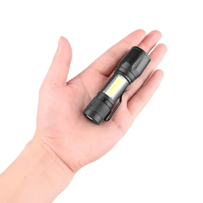 Simples Market black USB-rechargeable LED flashlight, 1000LM, compact zoomable torch held in hand
