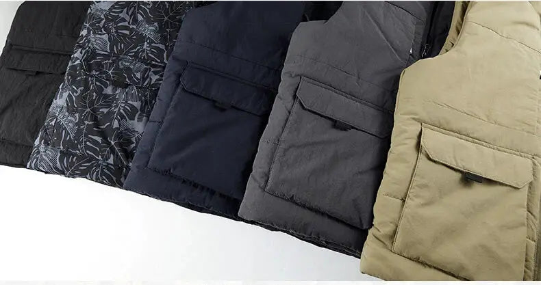 Five men's quilted fleece vests with large front pockets in black, patterned, navy, gray, and khaki.