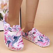 Pair of women's EVA garden clogs with back strap; pink marble pattern with white and purple swirls
