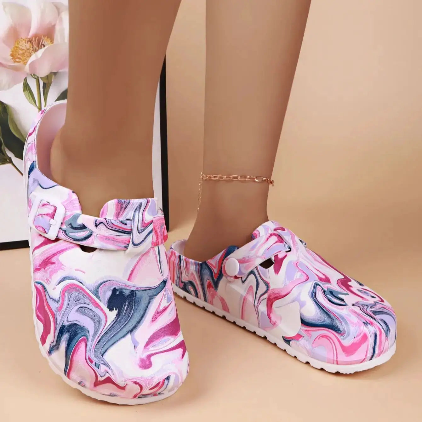 Pair of women's EVA garden clogs with back strap; pink marble pattern with white and purple swirls