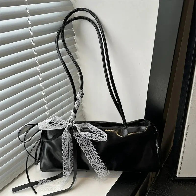 Black PU square shoulder bag with white lace bow accent.