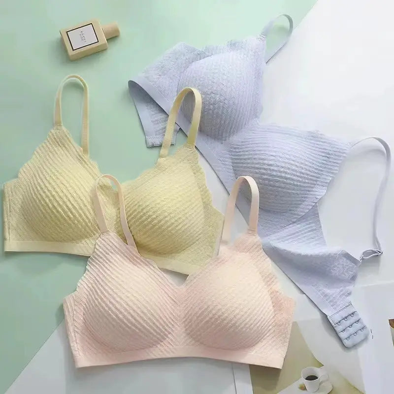 Bras set of four: pastel lace-textured seamless bras in beige, pale yellow, soft pink, and light blue.